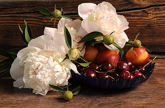 White Peonies and Fresh Fruit in Blue Bowl on Wood