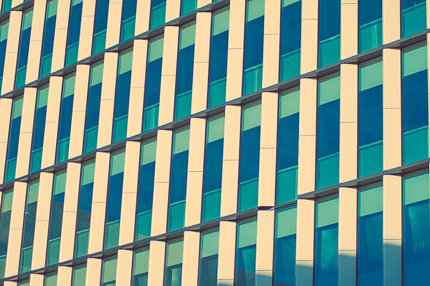 Modern office building facade with blue glass windows