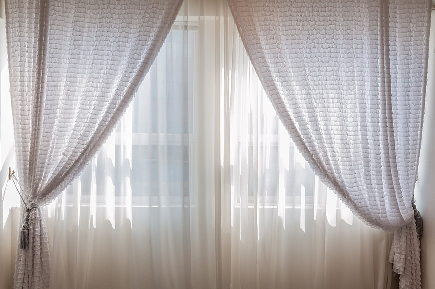 White textured curtains with soft natural light