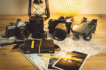 Photography equipment and travel planning on wooden table
