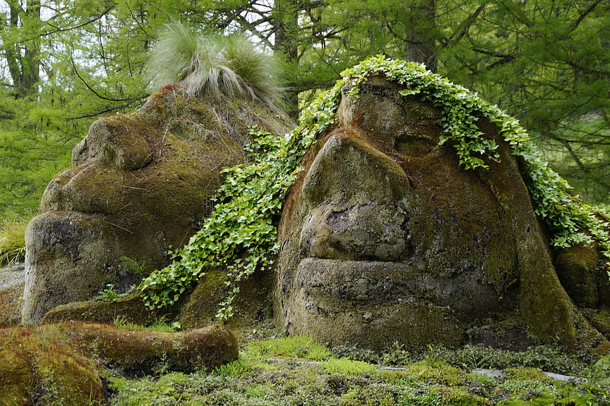 Mossy Stone Troll Sculptures in Forest