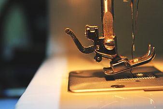 Close-up of vintage sewing machine needle and presser foot