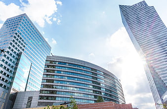 Modern Glass Skyscrapers and Office Buildings Under Blue Sky