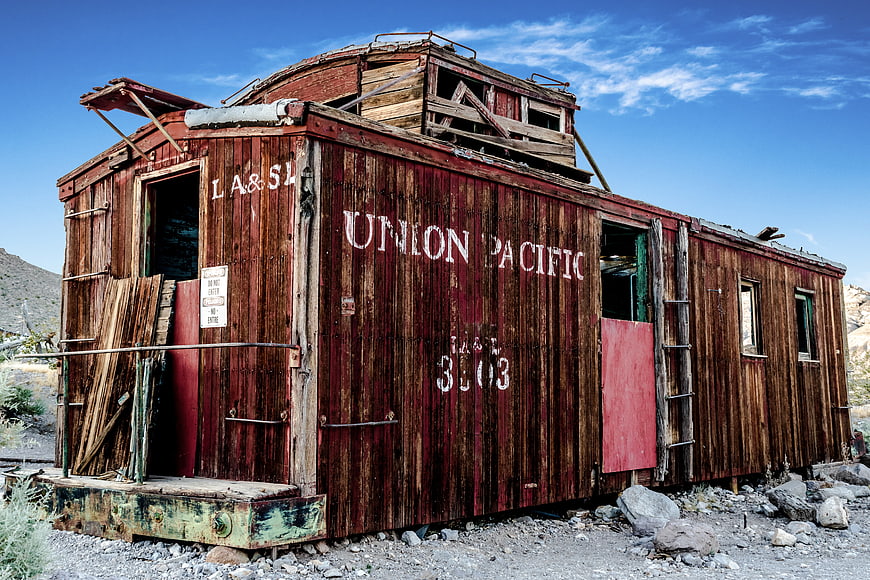 Abandoned Union Pacific Caboose in Desert Landscape
