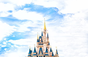 Disney Castle Against Blue Sky with Clouds