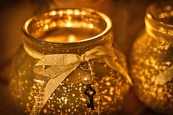 Warm Glowing Candle In Glass Jar With Gold Ribbon And Key Charm