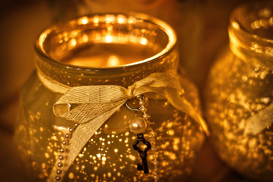 Warm Glowing Candle In Glass Jar With Gold Ribbon And Key Charm