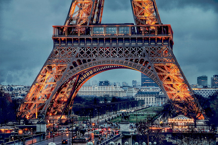 Eiffel Tower at Dusk with Golden Lights and Paris Skyline