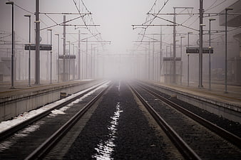 Foggy Train Tracks at Empty Railway Station