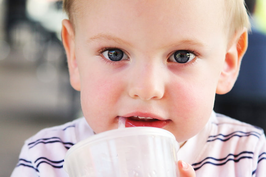 Close-up of Cute Toddler Boy Drinking from Cup