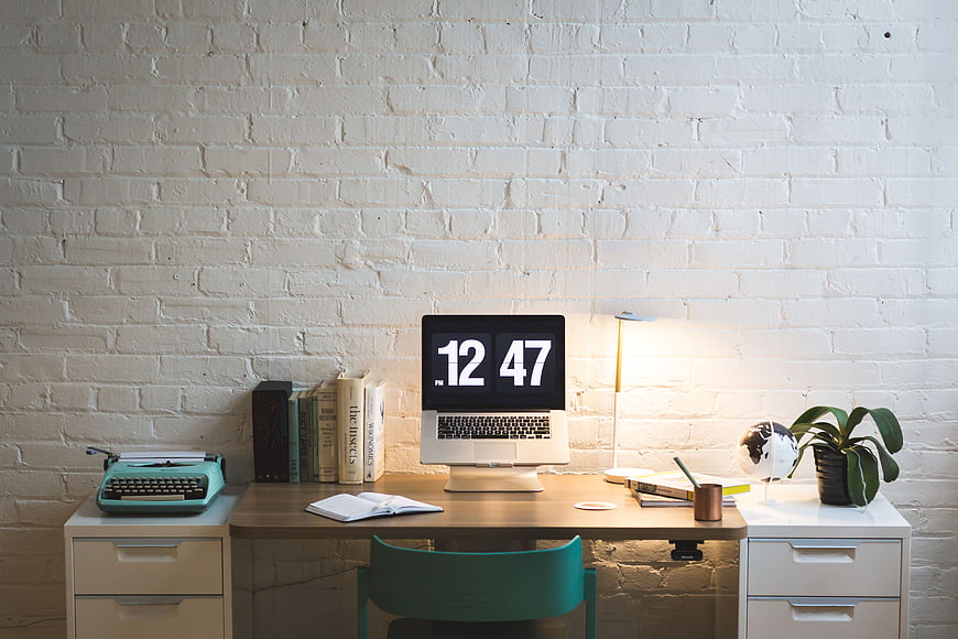 Modern Home Office Desk with Laptop and Typewriter