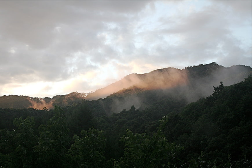 Misty Mountain Landscape with Golden Hour Sunlight