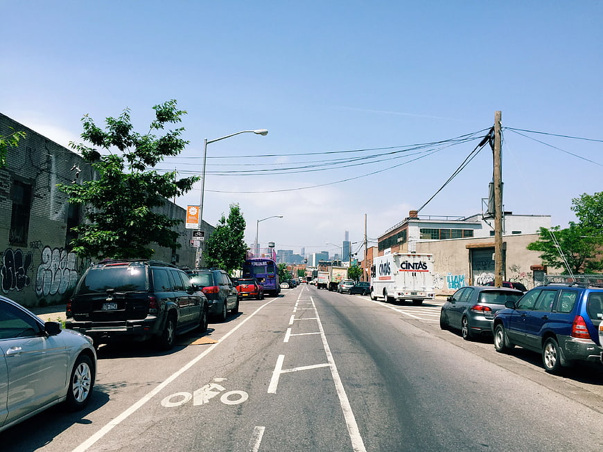 Urban Street Scene with Bike Lane and City Skyline