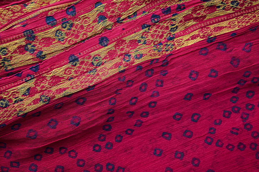 Vibrant Pink and Gold Patterned Silk Fabric Texture
