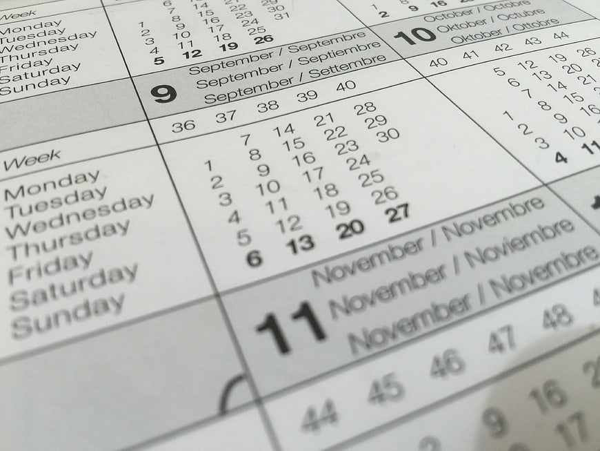 Close-up of white paper calendar showing September and November