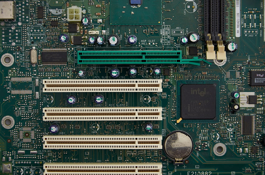 Close-up of vintage green computer motherboard with PCI slots