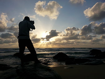 Silhouette of Photographer on Beach at Sunset