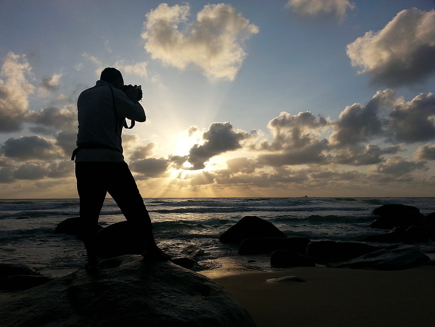 Silhouette of Photographer on Beach at Sunset