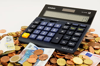 Casio Calculator on Pile of Euro Coins and Banknotes