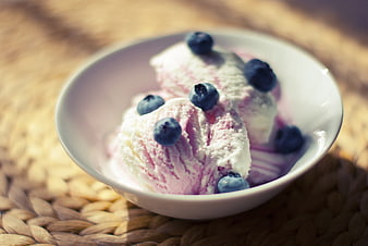 Blueberry Swirl Ice Cream in White Bowl on Woven Mat