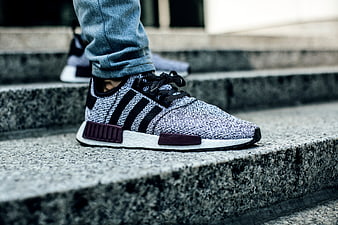Close-up of stylish sneakers on concrete stairs