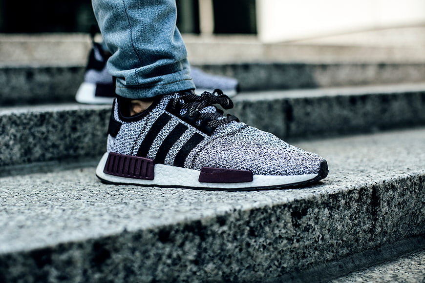 Close-up of stylish sneakers on concrete stairs