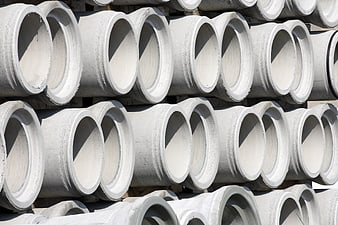 Stacked Concrete Drain Pipes In Industrial Storage Yard