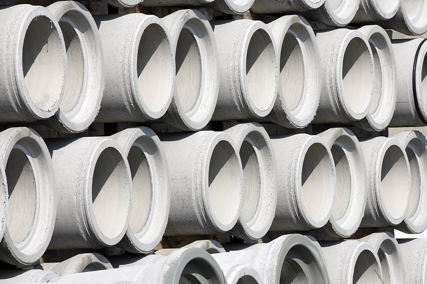 Stacked Concrete Drain Pipes In Industrial Storage Yard