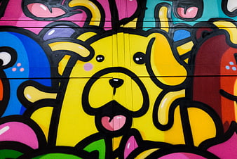 Colorful graffiti mural of a cute yellow dog character