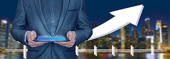 Businessman holding tablet with upward growth arrow and city skyline