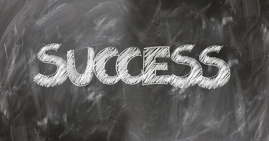 Success written in chalk on a blackboard background