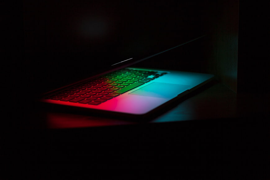 Laptop with RGB Backlit Keyboard in Dark Room