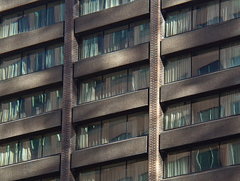 Modern Brick Building Facade with Rhythmic Window Patterns
