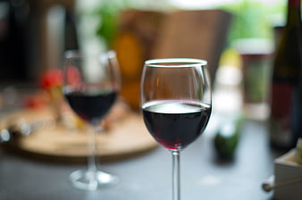 Close-up of red wine glasses on a dining table