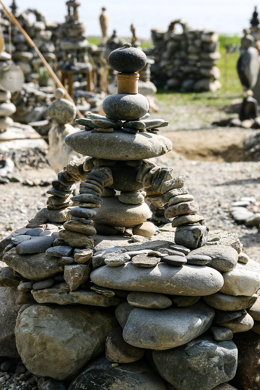 Intricate stone cairn sculpture with balanced pebbles outdoors