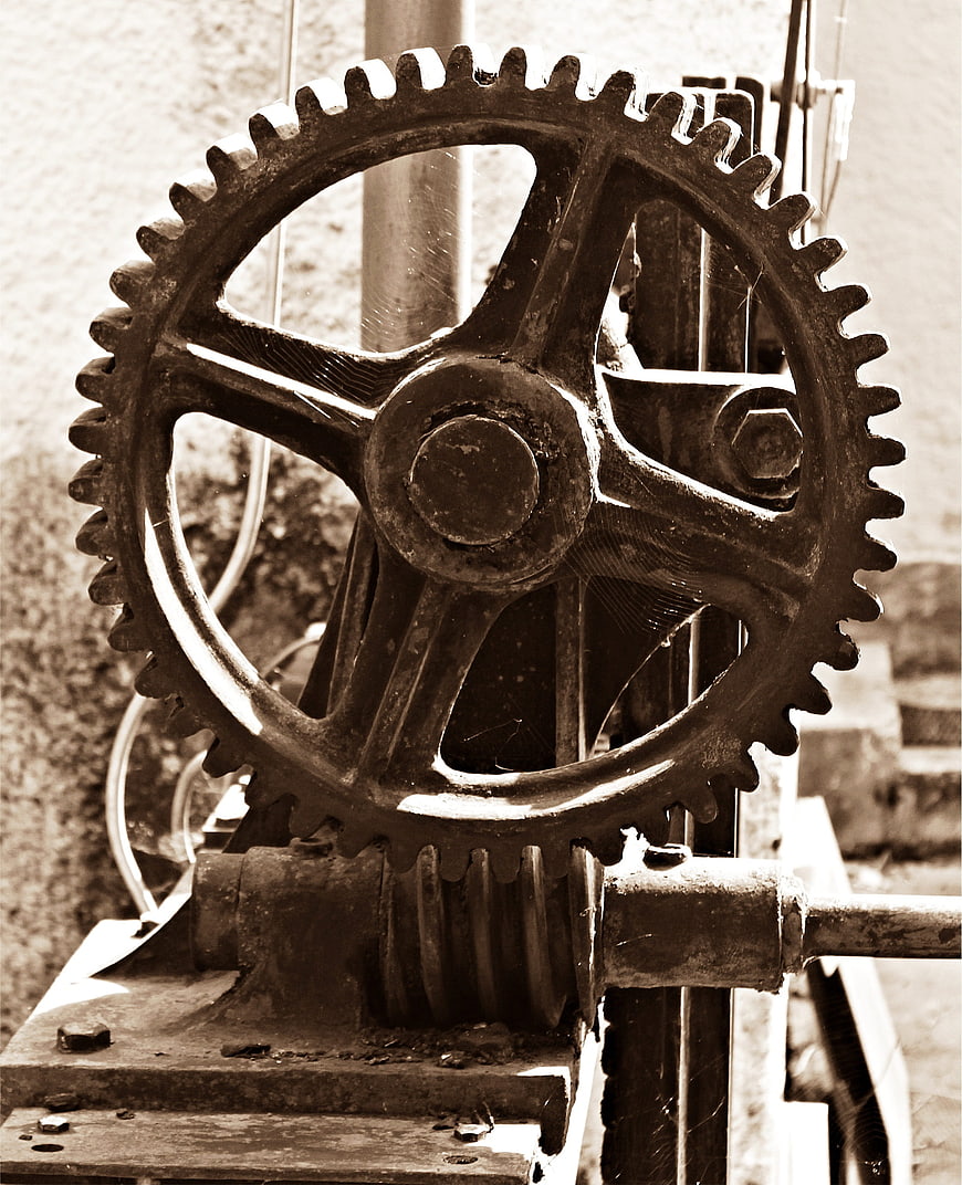 Vintage industrial gear mechanism in sepia tone