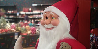 Close-up of smiling Santa Claus statue in Christmas store