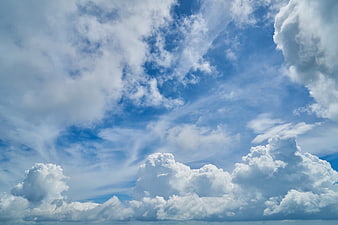 Dramatic Blue Sky with Fluffy White Cumulus Clouds
