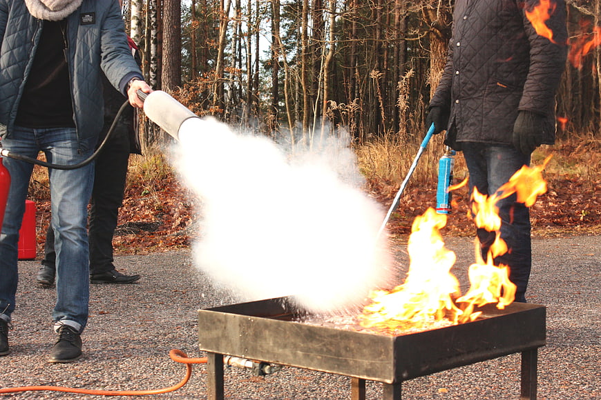 Fire Safety Training with Extinguishers in Outdoor Setting