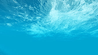 Underwater View of Turbulent Blue Water Surface with Bubbles