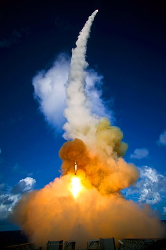 Rocket Launch From Naval Vessel With Dramatic Smoke Trail