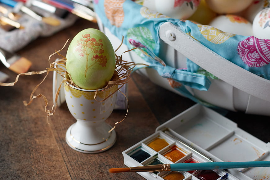Hand-painted Easter egg with watercolors and brush
