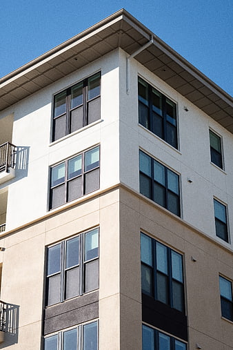 Modern Apartment Building Exterior with Blue Sky
