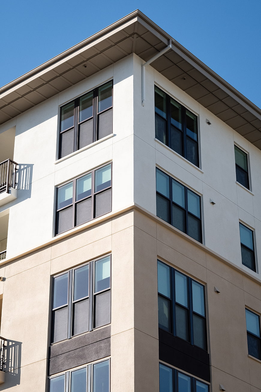 Modern Apartment Building Exterior with Blue Sky