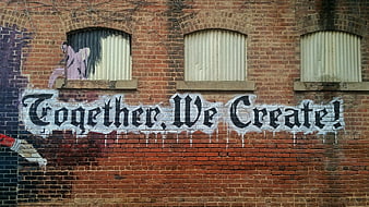 Together We Create Graffiti on Brick Wall