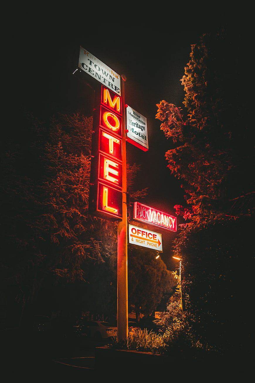 Vintage Neon Motel Sign at Night with No Vacancy