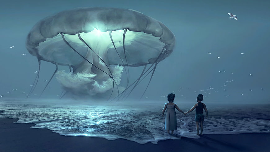 Two children holding hands watching giant glowing jellyfish on beach