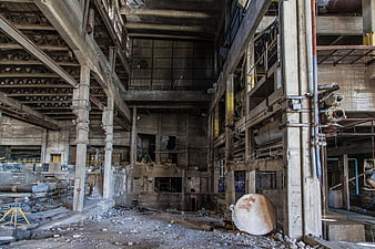 Interior of Abandoned Industrial Factory with Concrete Pillars