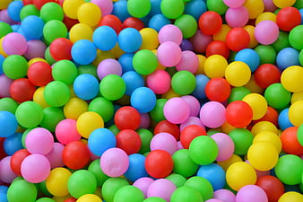 Close-up of colorful plastic balls in a children's ball pit