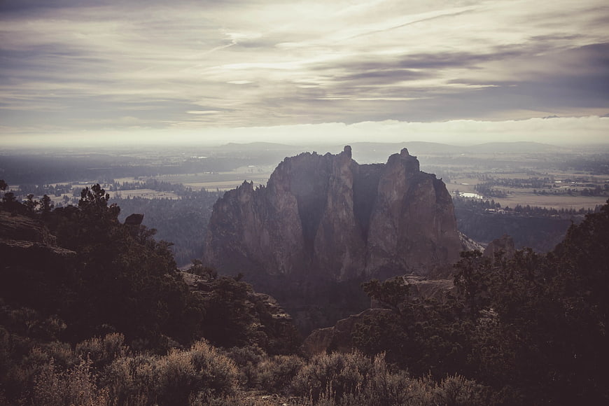 Dramatic Smoky Mountain Rock Formation in Hazy Forest Landscape